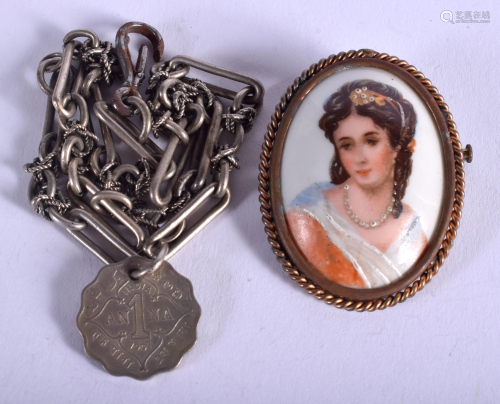 A SILVER BRACELET and brooch. (2)