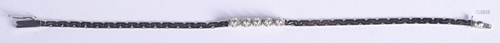 A 14CT WHITE GOLD AND DIAMOND BRACELET. 4.…