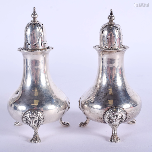 A PAIR OF ANTIQUE SILVER CONDIMENTS. London…