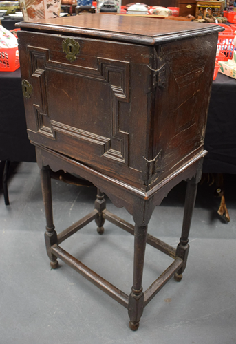 A 17TH/18TH CENTURY OAK SPICE CUPBOARD ON S…