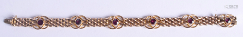 AN ANTIQUE 9CT GOLD AND AMETHYST BRACELET. 1…