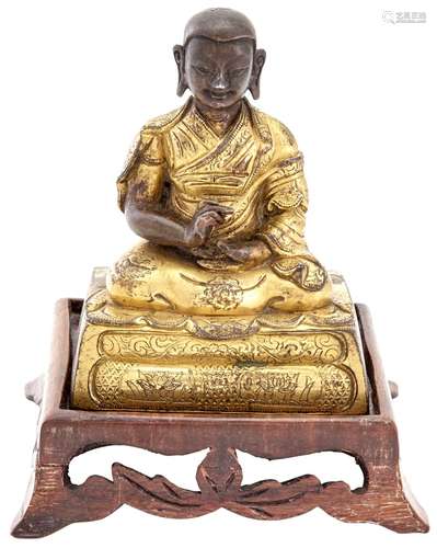 A Tibeto-Chinese Gilt Bronze Figure of an Arhat