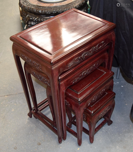 A NEST OF FOUR CHINESE RED WOOD TABLES …