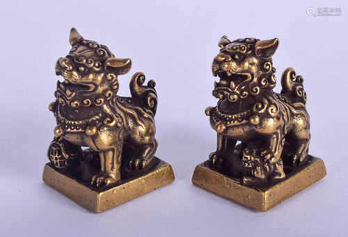 A PAIR OF CHINESE BRONZE BUDDHISTIC LION S…