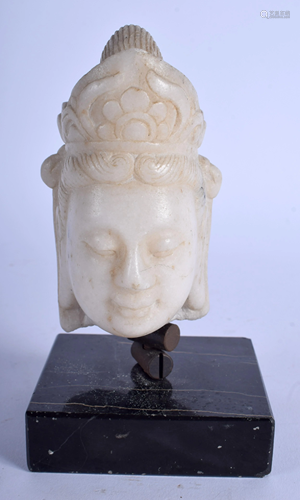 A CHINESE CARVED MARBLE BUST OF A BUDDHIST…