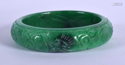 A CHINESE GREEN JADE BANGLE 20th Century. 7.25 cm