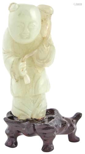 A Chinese Pale Celadon Jade Carving of a Boy Attendant