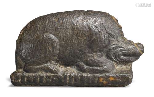 AN UNUSUAL STONE FIGURE OF A RECUMBENT BOAR