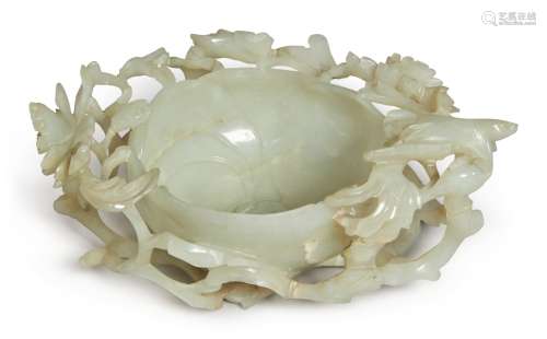 A CELADON JADE 'BIRD AND FLOWER' CUP, MING DYNASTY