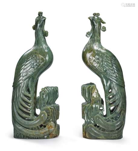 A PAIR OF LARGE SPINACH-GREEN JADE FIGURES OF PHOENIXES, 19TH / 20TH CENTURY