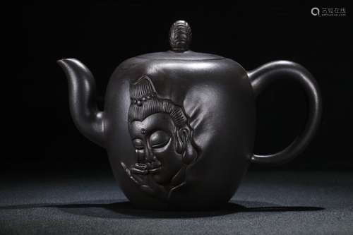 A Zisha Teapot With Buddha Head Pattern