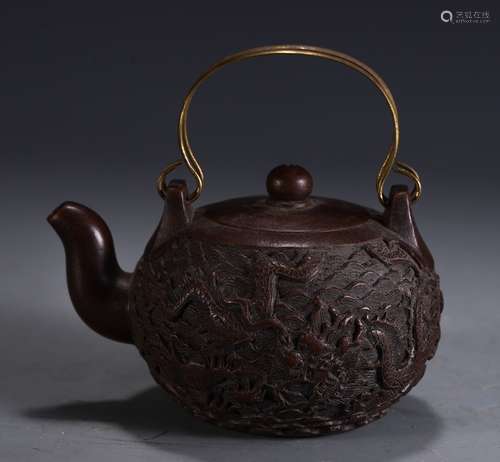 A Zisha Teapot With Dragon Carving And Marking