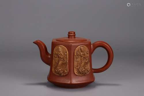 A Zisha Teapot With Guanyin And Dragon Carving