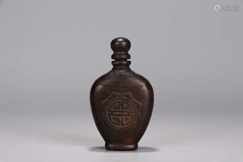 A Chinese Agarwood Snoof Bottle With Auspicious Pattern