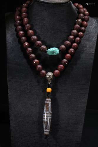 An Agate Necklace With Dzi And Puti