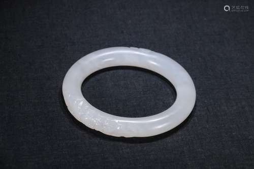 A Chinese Hetian Jade Bangle With Flower Pattern