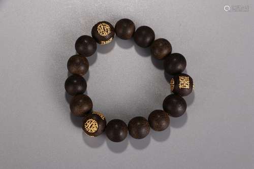 A Chinese Agarwood Bracelet With Golden Beads