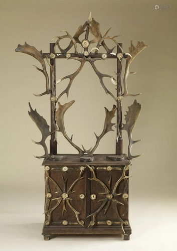 . Antlers rifle rack decorated with antlers Central