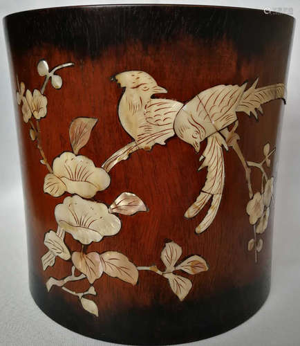 A RED WOOD BRUSH POT EMBEDDED WITH CONCH