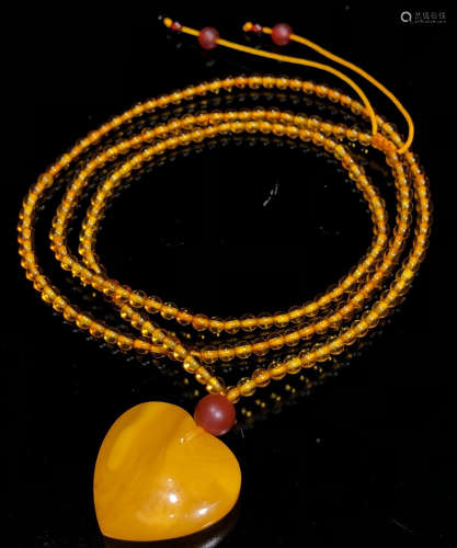 A BEESWAX PENDANT WITH CHAIN