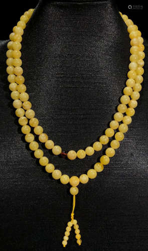 A BEESWAX SRTING NECKLACE WITH 108 BEADS