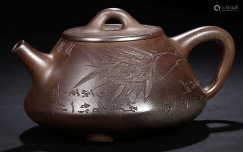 A ZISHA TEA POT CARVED WITH BAMBOO PATTERN