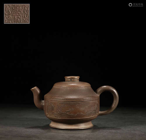 A ZISHA TEA POT CARVED WITH LANDSCAPE PATTERN