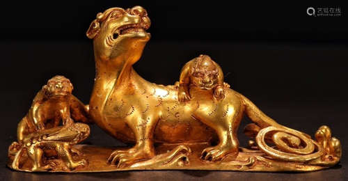 A GILT BRONZE BEAST PENDANT