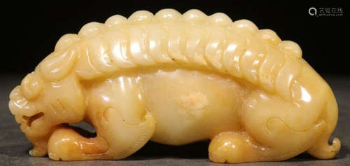 A HETIAN JADE BEAST PENDANT