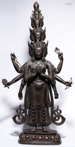 A COPPER GUANYIN BUDDHA WITH EIGHT ARMS