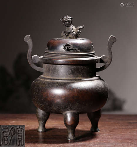 A COPPER CENSER WITH BEAST COVER