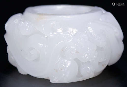 A HETIAN JADE RING CARVED WITH BEAST PATTERN