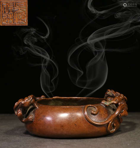 A COPPER CENSER CARVED WITH BEAST