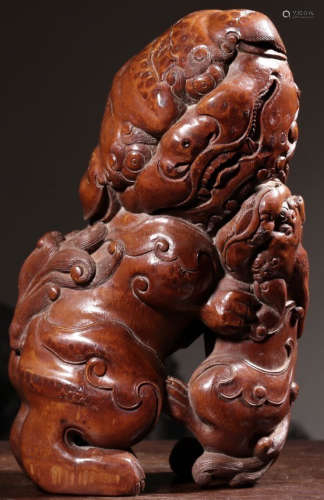 A BAMBOO ORNAMENT CARVED WITH LION