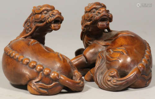 PAIR OF HUANGYANG WOOD PAPERWEIGHT SHAPED WITH BEAST