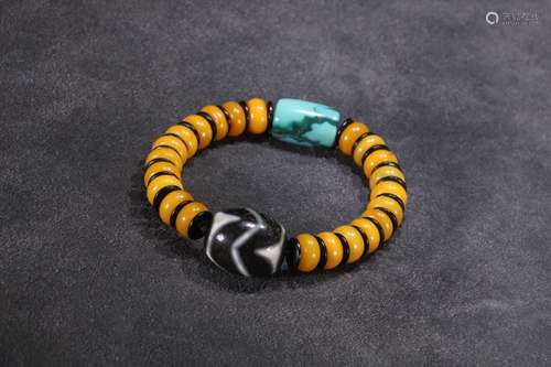 A Chinese Amber Bracelet With Dzi