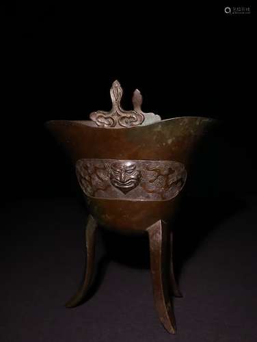 A Chinese Bronze Ware Vessel With Beast Pattern