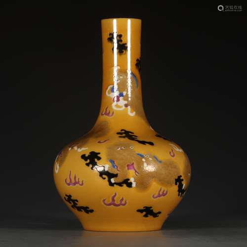 A Chinese Porcelain Yellow Glazed Bottle Vase With Beast Pattern