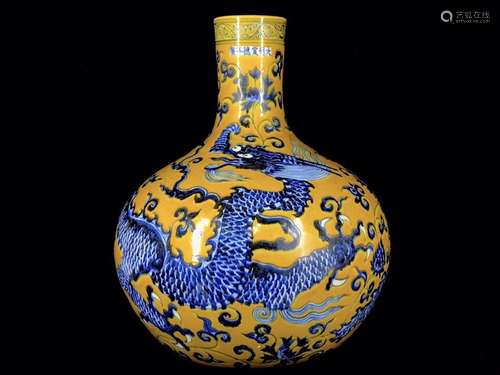 A Chinese Porcelain Yellow Glazed Blue And White Bottle Vase With Dragon Pattern