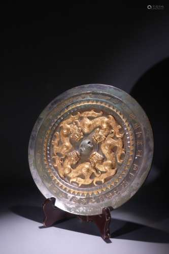 A Chinese Gilt Bronze Mirror With Dragon Pattern