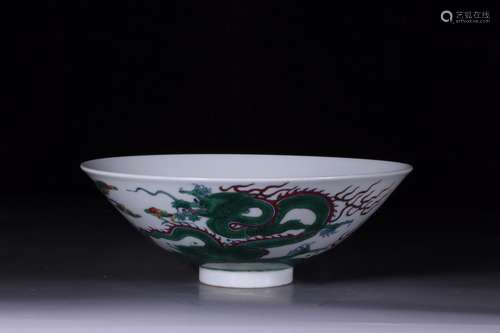 A Chinese Porcelain Blue And White Bowl With Dragon Pattern