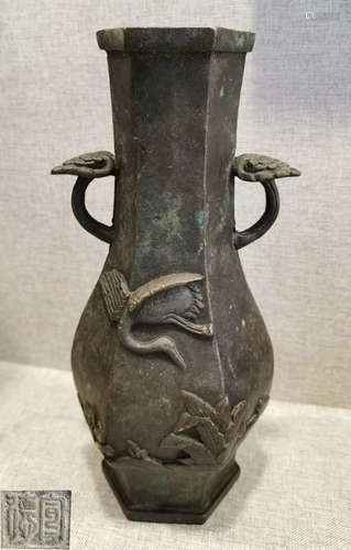 A COPPER VASE CARVED WITH CRANE