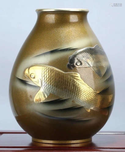 A COPPER VASE CARVED WITH FISH