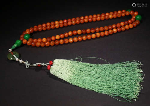 AN OLD BEESWAX STRING NECKLACE WITH 108 BEADS
