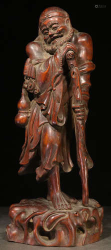 A HUANGYANG WOOD FIGURE STATUE