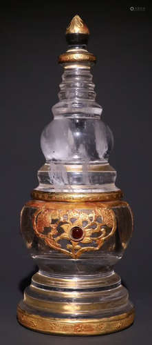 A CRYSTAL PAGODA EMBEDDED WITH GOLD