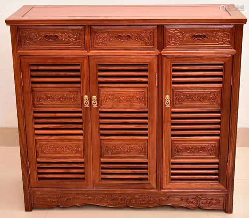 A HUALI WOOD CABINET CARVED WITH FLOWER PATTERN