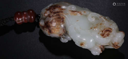 A HETIAN WHITE JADE BEAST PENDANT