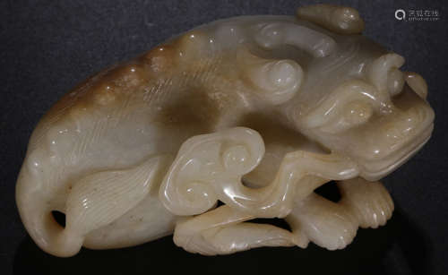 A HETIAN WHITE JADE BEAST PENDANT