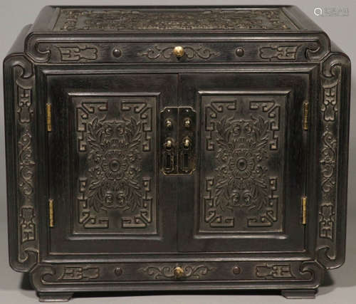 A ZITAN WOOD CABINET CARVED WITH FLOWER PATTERN